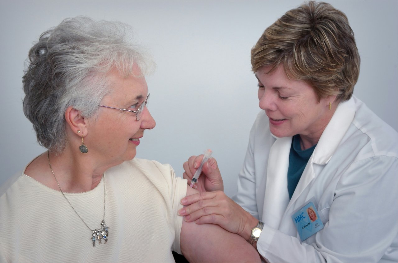 nurse giving vaccination