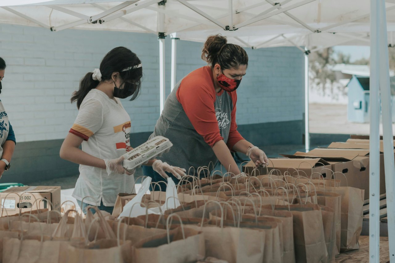volunteers packing food