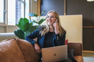 woman with computer and phone applying for job